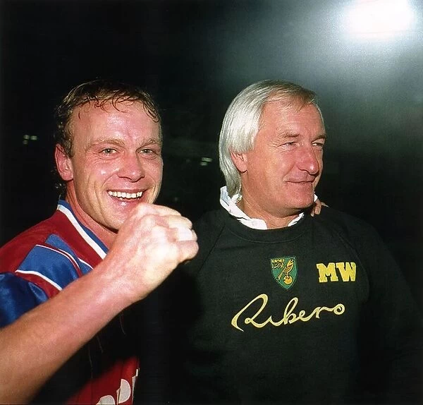 Jeremy Goss Norwich City footballer celebrates with manager Mike Walker after beating