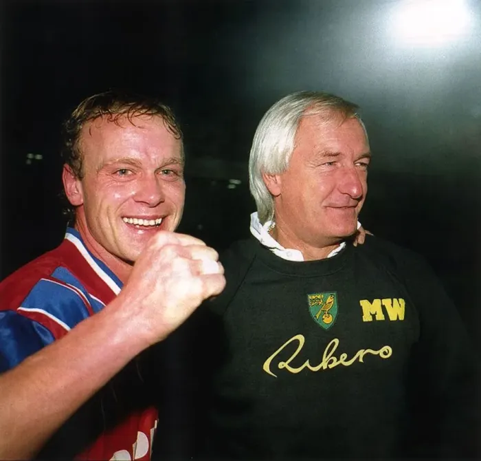 Framed Print : Jeremy Goss Norwich City footballer celebrates with manager Mike Walker after beating Framed Print : Jeremy Goss Norwich City footballer celebrates with manager Mike Walker after beating