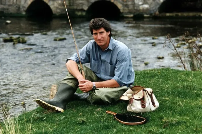 Framed Print : Jeremy Paxman tv presenter of Newsnight and journalist with his fishing gear on riverbank