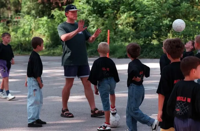 Framed Print : Jerome Flynn actor visits Bosnia and plays football with the children