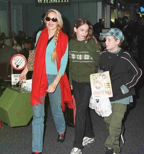 Jerry Hall and children Elizabeth Scarlet and James leaveing Heathrow for Christmas in