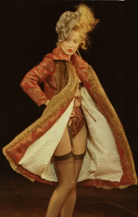 Framed Print : Jerry Hall models for Vivienne Westwood at Paris Fashion Week Wearing a long coat
