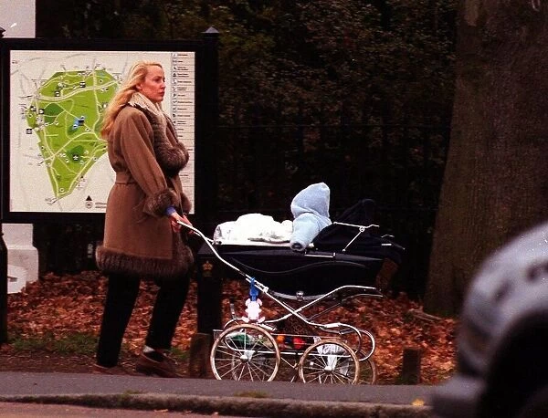 Jerry Hall in Richmond Park London in December 1998, pushing the pram of her fourth child