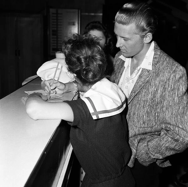 Jerry Lee Lewis and his 13-year-old wife Myra at London Airport to fly home