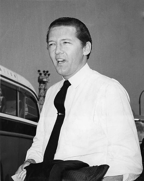 Jerry Lee Lewis, pictured arriving at London Airport to start his second tour of England