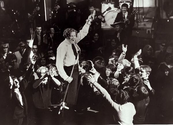 Jerry lee Lewis Singer - performing on stage, surrounded by fans - singing