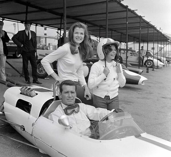 Jessica Walter with actor James Garner in a Maclaren sports car which has been painted