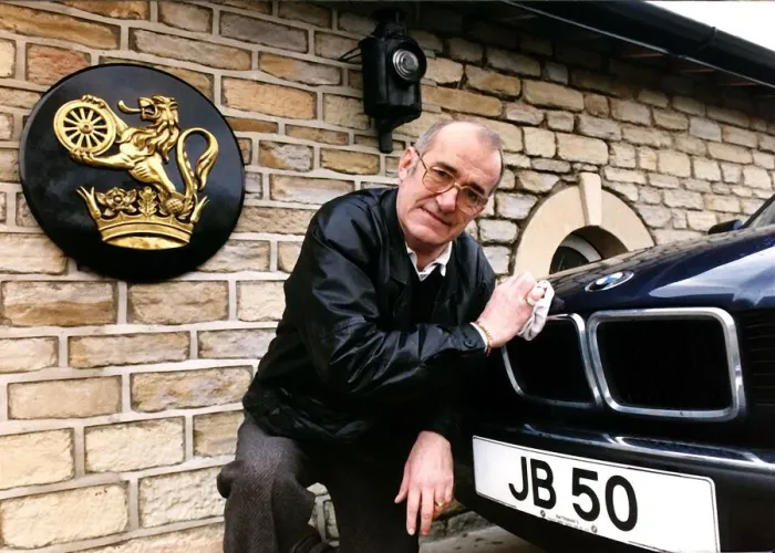 Framed Print : Jim Bowen Comedian / TV Presenter polishing his BMW car Framed Print : Jim Bowen Comedian / TV Presenter polishing his BMW car