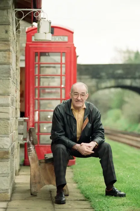 Framed Print : Jim Bowen by the railway which passes by his house in Arkholme, Lancashire