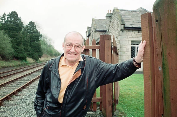 Jim Bowen by the railway which passes by his house in Arkholme, Lancashire