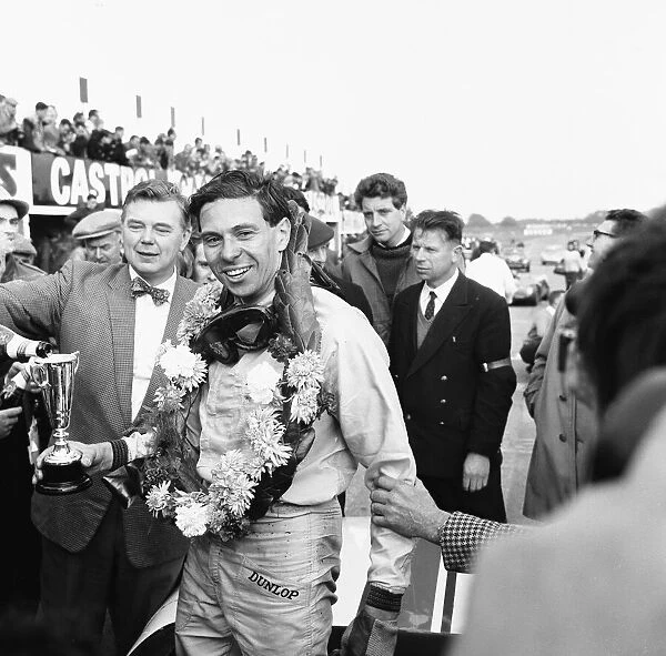 Jim Clark celebrates winning the Martini Rossi Trophy race at Snetterton 29th September