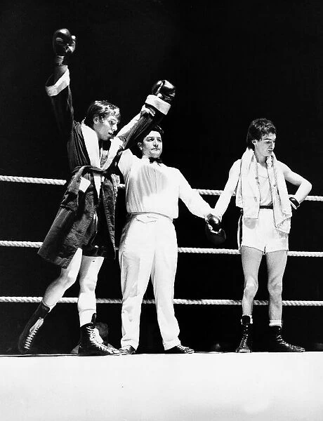 Jim Crilly with his arms in the air celebrating his victory over dejected Stewart Ogilvie