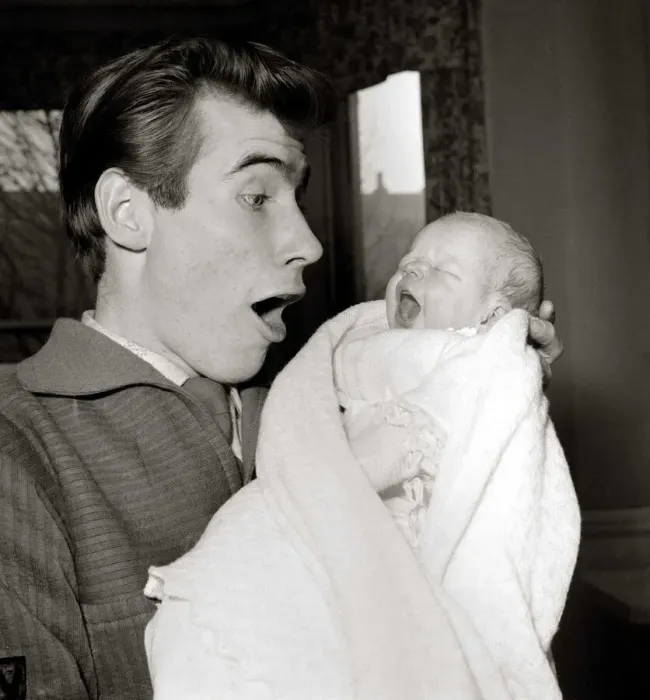 Framed Print : Jim Dale holds his new born baby girl Jane Belinda after her birth at a nursing home in Framed Print : Jim Dale holds his new born baby girl Jane Belinda after her birth at a nursing home in