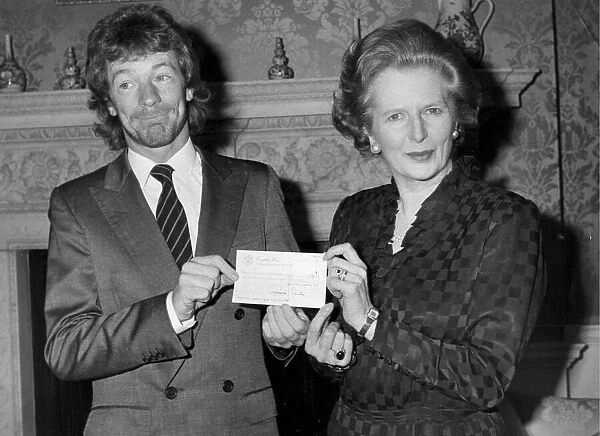Jim Davidson presenting cheque to Margaret Thatcher during reception at Number 10 Downing