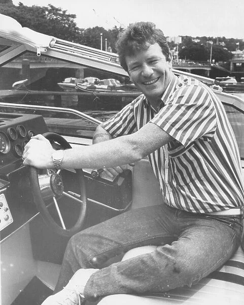 Jim Davidson at the wheel of his Princess boat on Torquay Marina20th July1987
