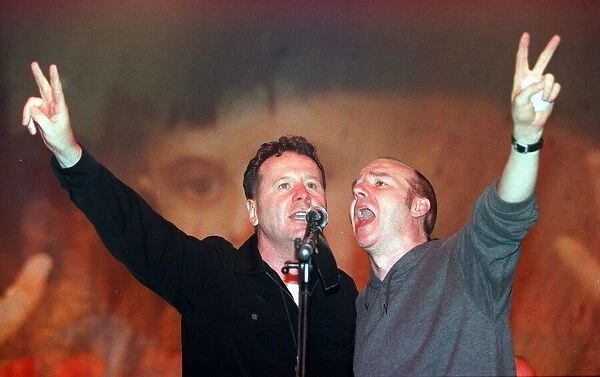 Jim Kerr of Simple Minds and Midge Ure May 1999 sing at the finale of the Scotland Rocks