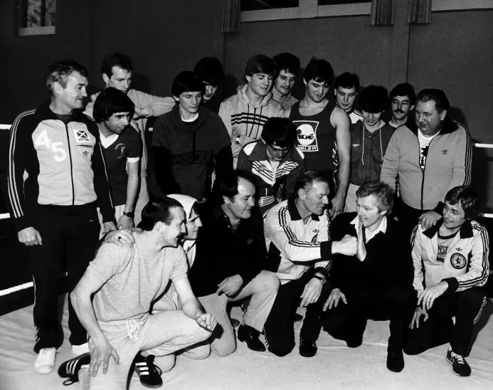 Framed Print : Jim watt playfully spars with Dick McTaggart as they and other boxers attend a training Framed Print : Jim watt playfully spars with Dick McTaggart as they and other boxers attend a training