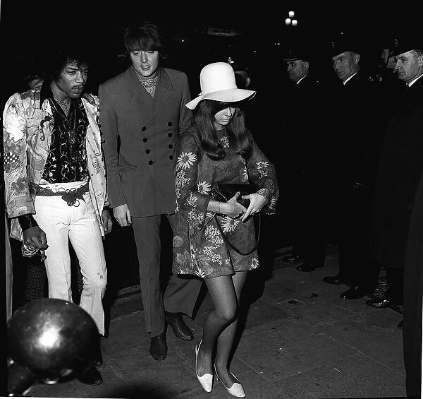 Jimi Hendrix singer guitarist arriving at function 1967 with friends