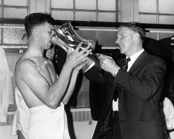 Jimmy Adamson the Burnley Captain seen receiving champagne from Spurs manager Bill