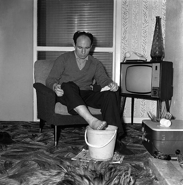 Jimmy Melia April 1963 Football Player at home soaking his feet