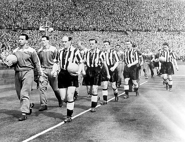 JIMMY SCOULAR LEADS NEWCASTLE UNITED ONTO THE PITCH AT WEMBLY FOR THE FA CUP FINAL, 1955