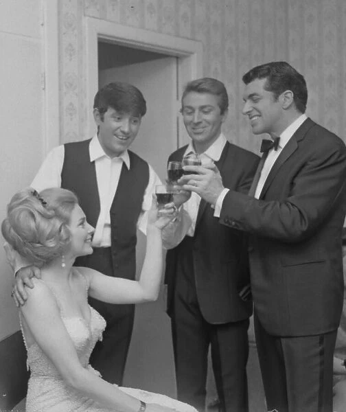 Jimmy Tarbuck, Des O Connor and Frankie Vaughan enjoy a celebratory drink with French