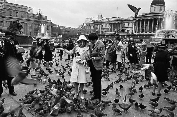 Jimmy Tarbuck in Trafalgar Square, London with Miss Liverpool Maureen Martin