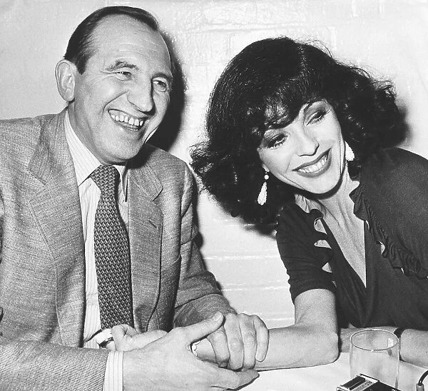 Joan Collins actress with actor Leonard Rossiter during dinner at The Neal Street