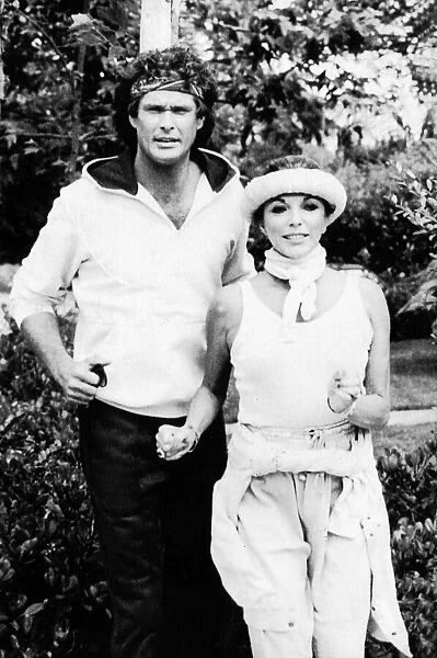 Joan Collins the actress with David Hasselhoff the actor jogging together. July 1984