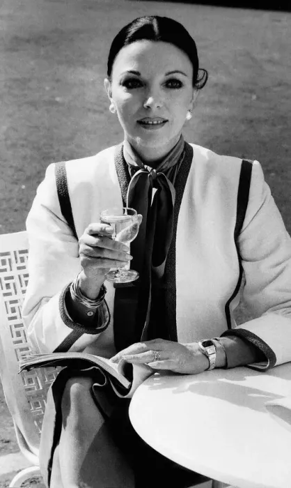 Framed Print : Joan Collins actress with her hair tied back and holding a wine glass Framed Print : Joan Collins actress with her hair tied back and holding a wine glass