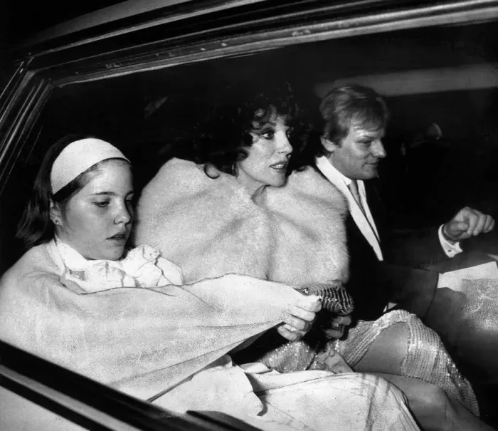 Framed Print : Joan Collins, actress, leaving a party with her family in May 1985