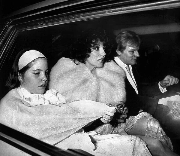 Joan Collins, actress, leaving a party with her family in May 1985