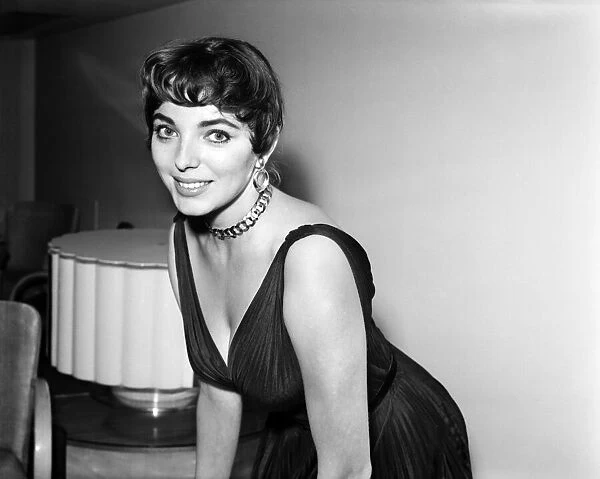 Joan Collins, actress, pictured at home, with family and friends, London