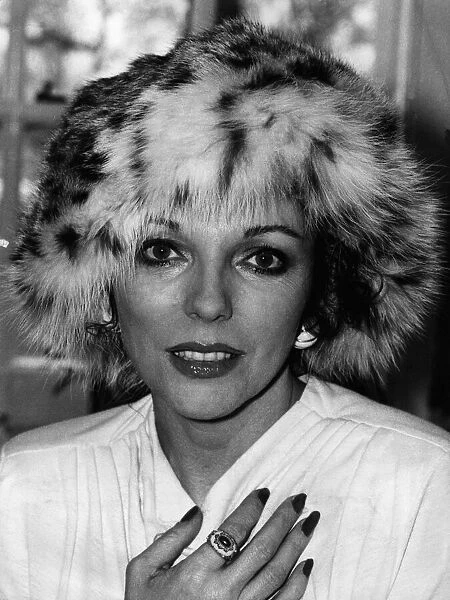 Joan Collins actress wearing a fur hat