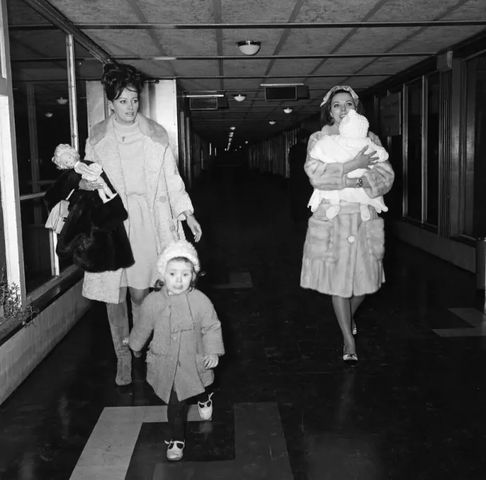 Framed Print : Joan Collins arriving by British European Airways from Paris with her daughter Tara