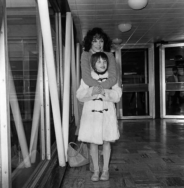 Joan Collins at Heathrow Airport with her daughter Katyana after a holiday in the Bahamas