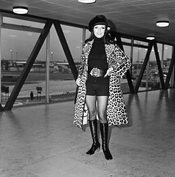 Joan Collins at Heathrow Airport today, she is going to Rome for a holiday