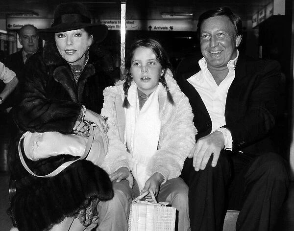 Joan Collins with her husband and her daughter at Heathrow on their way back to San