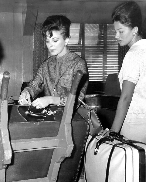 Joan Collins and sister Jackie Collins at London Airport - September 1960