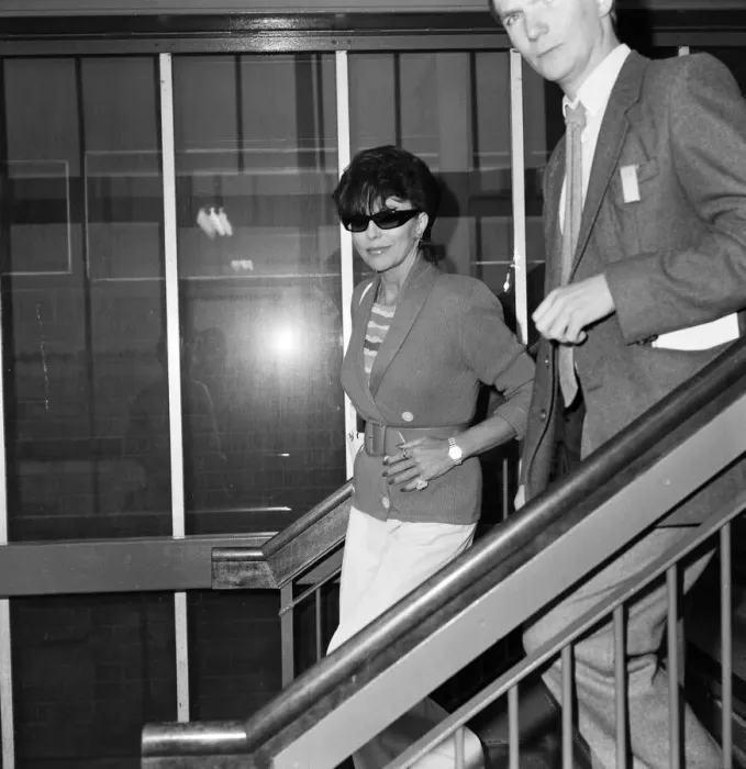 Framed Print : Joan Collins with her son Sacha, 17, arriving at Heathrow from Los Angeles Framed Print : Joan Collins with her son Sacha, 17, arriving at Heathrow from Los Angeles