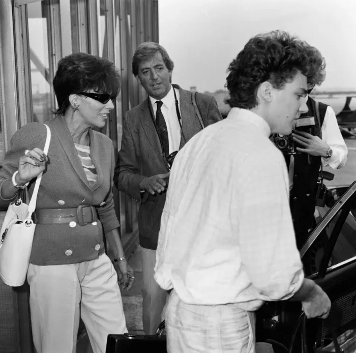 Framed Print : Joan Collins with her son Sacha, 17, arriving at Heathrow from Los Angeles Framed Print : Joan Collins with her son Sacha, 17, arriving at Heathrow from Los Angeles