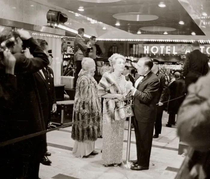 Framed Print : Joan Crawford at the Premier of My Fair Lady film in New York speaking to reporter