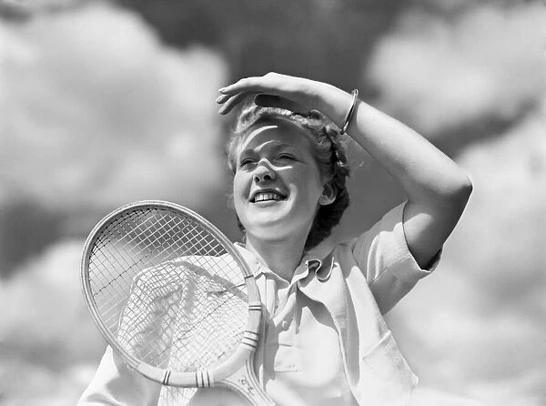 Joan Wood with tennis racket. 3rd August 1938