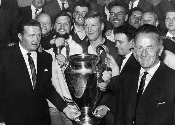 Jock Stein proudly shows off the European Cup to Scottish referees at the Middleton