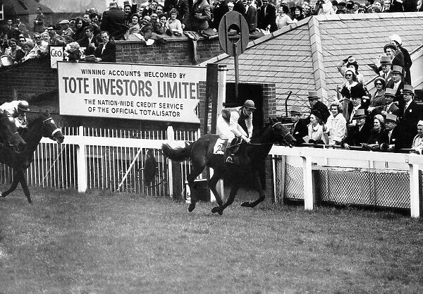 Jockey Scobie Breasley on racehorse Santa Claus wins the Epsom Derby from Indiana