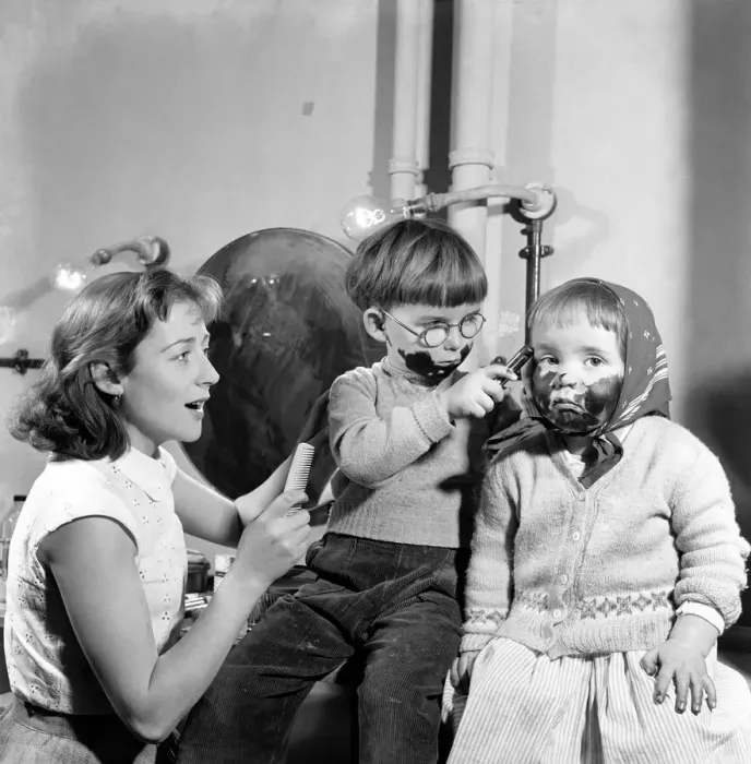 Framed Print : Joe, 4, and Tessa 2, play with the grease paint as their mother Helena Hughes, (Mrs Framed Print : Joe, 4, and Tessa 2, play with the grease paint as their mother Helena Hughes, (Mrs