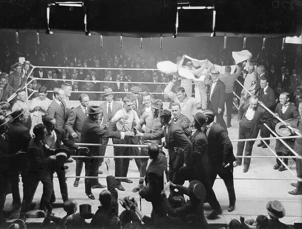 Joe Beckett celebrates with his supporters after knocking out Frank Goddard in