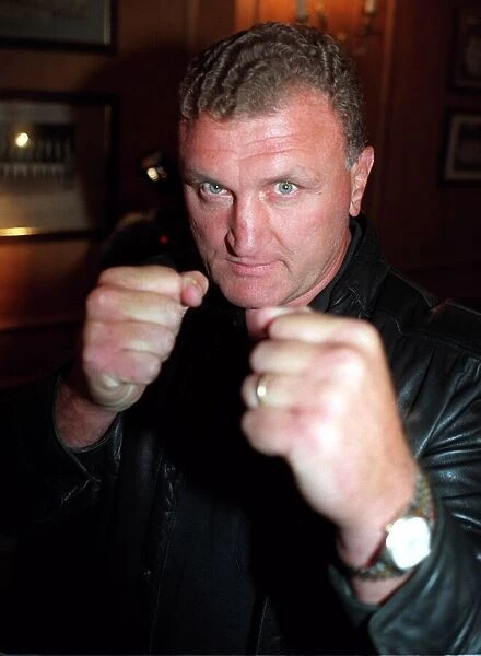 Joe Bugner poses for photographers before his fight with Scott Welch in Berlin, Germany