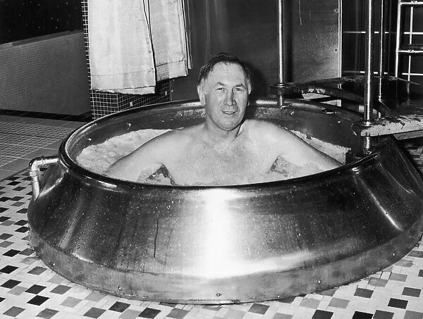 Joe Mercer the Manchester City manager seen here soaking in a tub at Blackpool sauna bath