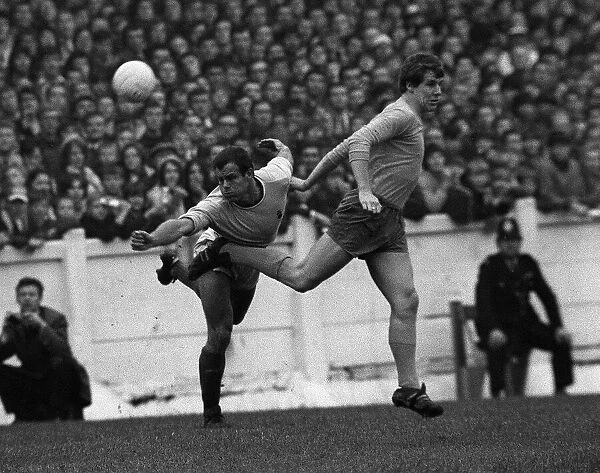 Joe Royle of Everton is beaten to the ball by Coventrys George Curtis